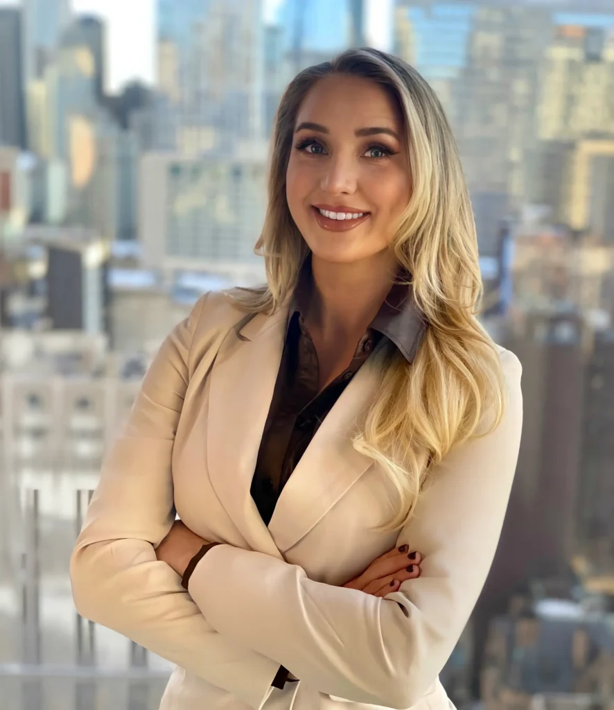 Madeline Schmidt working at her desk, entertainment attorney for content creators